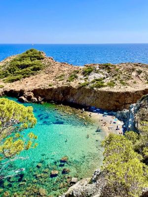 Cala s'Eixugador is a hidden gem nestled between stunning cliffs, offering a tranquil retreat away from the crowds. Ideal for swimming and sunbathing, its pristine waters attract nature lovers and adventurers. Accessing this secluded beach requires a short hike, adding to its charm and making it a perfect spot for relaxation and exploration.