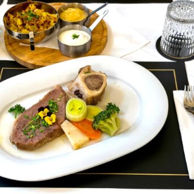 At Restaurant Vienne, you'll dive into the heart of Austrian cuisine, enjoying beautifully presented dishes in an elegant, yet comfortable ambiance. Known for its fresh ingredients and traditional recipes, the restaurant offers a welcoming experience perfect for food lovers looking to indulge in Wien’s culinary delights. Don't miss their signature schnitzel!