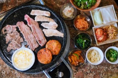 Hae Jang Chon offers a delightful dive into Korean cuisine with its interactive BBQ grill at each table. You can choose from a variety of marinated meats and fresh vegetables to grill to perfection. The vibrant ambiance and friendly service make it a perfect spot for meat lovers and group gatherings to enjoy a one-of-a-kind dining experience.