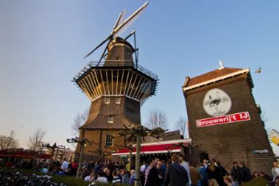 Brouwerij 't IJ is the perfect spot for beer lovers visiting Amsterdam. This unique brewery, situated next to a historic windmill, offers a wide selection of artisan beers crafted on-site. The atmosphere is laid-back, and you can enjoy your drink in the outdoor garden or cozy tasting room. Don't miss the seasonal brews and local snacks!