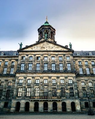 The Royal Palace Amsterdam, located on Dam Square, offers a fascinating glimpse into the Dutch monarchy's rich history. Explore its stunning architecture and lavish interiors, with beautifully decorated rooms that once served as the Royal family's home. Don't miss the impressive art collection and the grand ballroom, which will leave you in awe.
