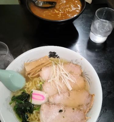 Ramen SYOTEN is a beloved gem in Hakodate, renowned for its rich and flavorful broth that captures the essence of Hakodate-style ramen. Each bowl is crafted with care, featuring homemade noodles and fresh ingredients that create a delightful dining experience. Locals rave about the welcoming atmosphere and quick service, making it an ideal stop for a hearty meal.