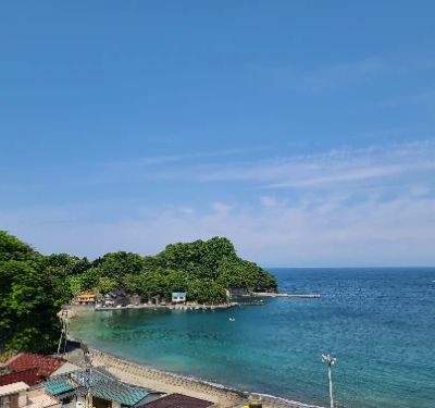 Iwachi Beach is an idyllic escape nestled in Matsuzaki, offering crystal-clear waters and soft sands perfect for sunbathing and relaxation. The scenic views of the surrounding landscapes create a tranquil atmosphere, ideal for a day of unwinding. Whether swimming or enjoying a picnic, this beach is a must for nature lovers visiting the area.